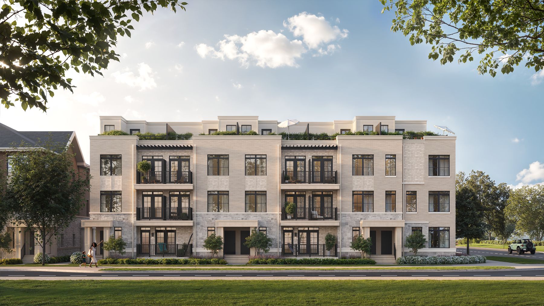 South Banks townhomes in light brick and stone, facing the street